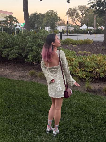 A back view of Allure commerce editor Sarah Han wearing the Sticky Cakes Lift underneath a green dress with a low back